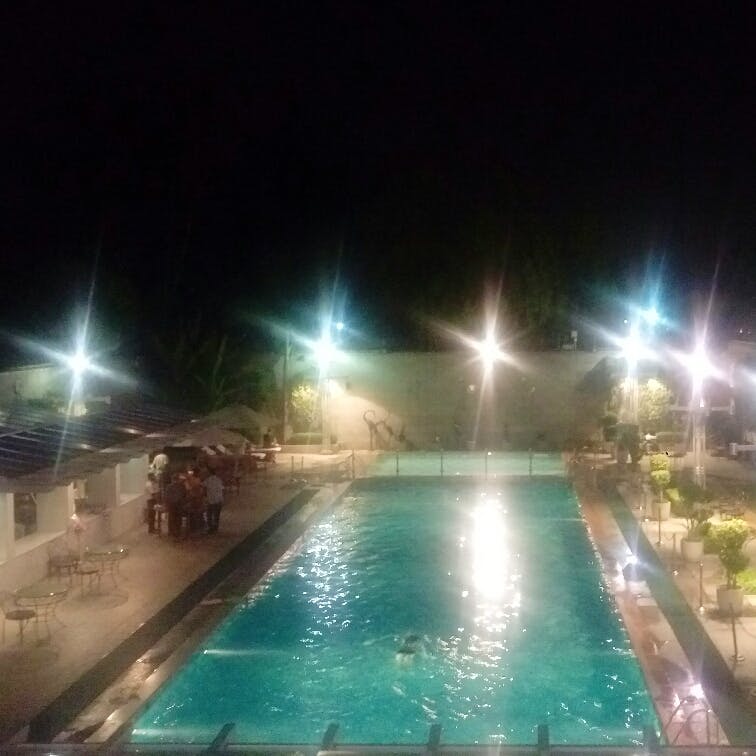 Swimming pool,Night,Light,Water,Lighting,Sky,Leisure centre,Leisure,Cloud,Fun