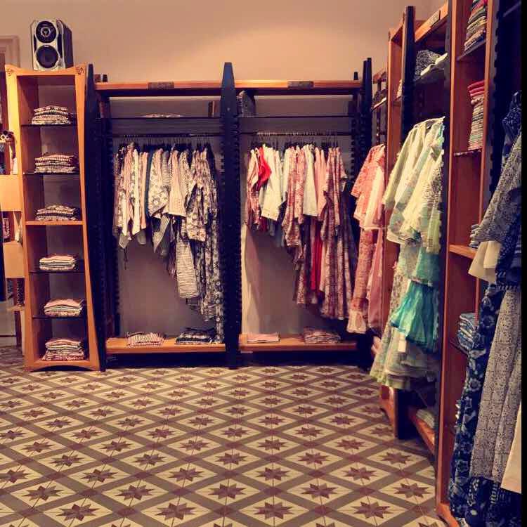 Closet,Room,Boutique,Furniture,Floor,Clothes hanger,Wardrobe,Textile,Flooring,Dress
