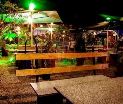 Night,Lighting,Restaurant,Bar,Tree,Table,Architecture,Landscape lighting,Building,House