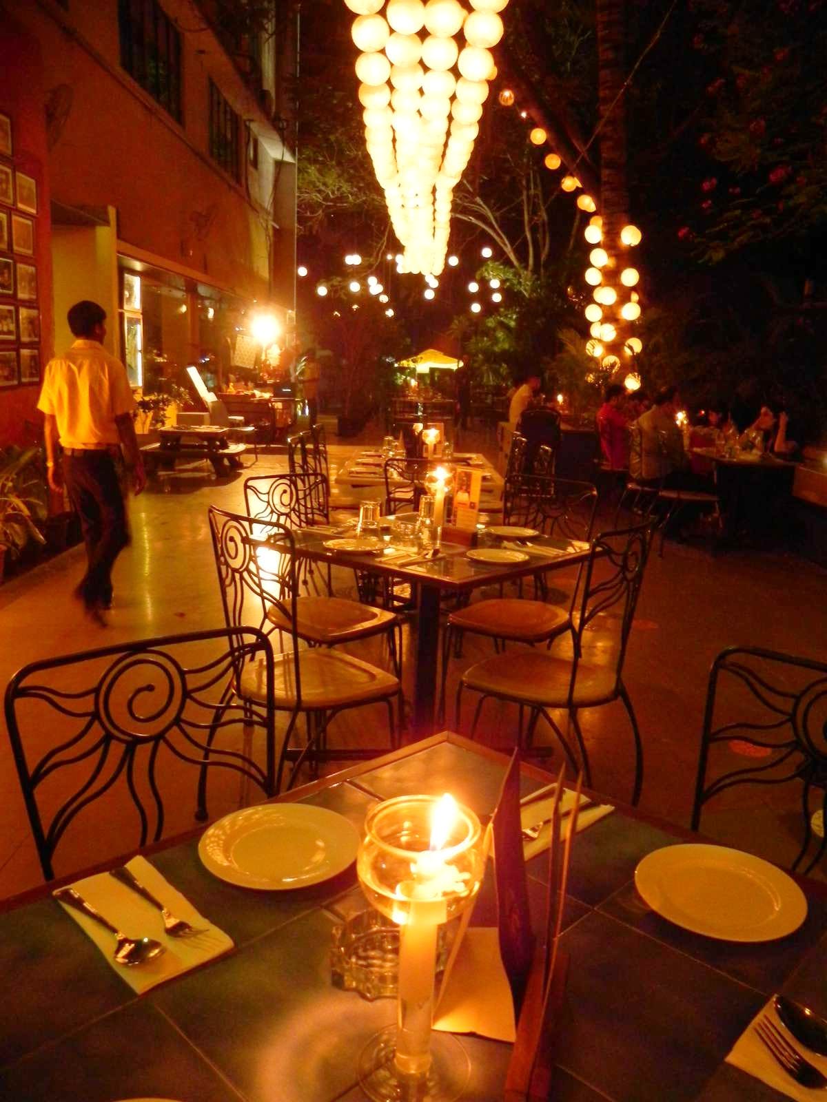 Lighting,Lantern,Table,Restaurant,Lighting accessory,Light fixture,Interior design