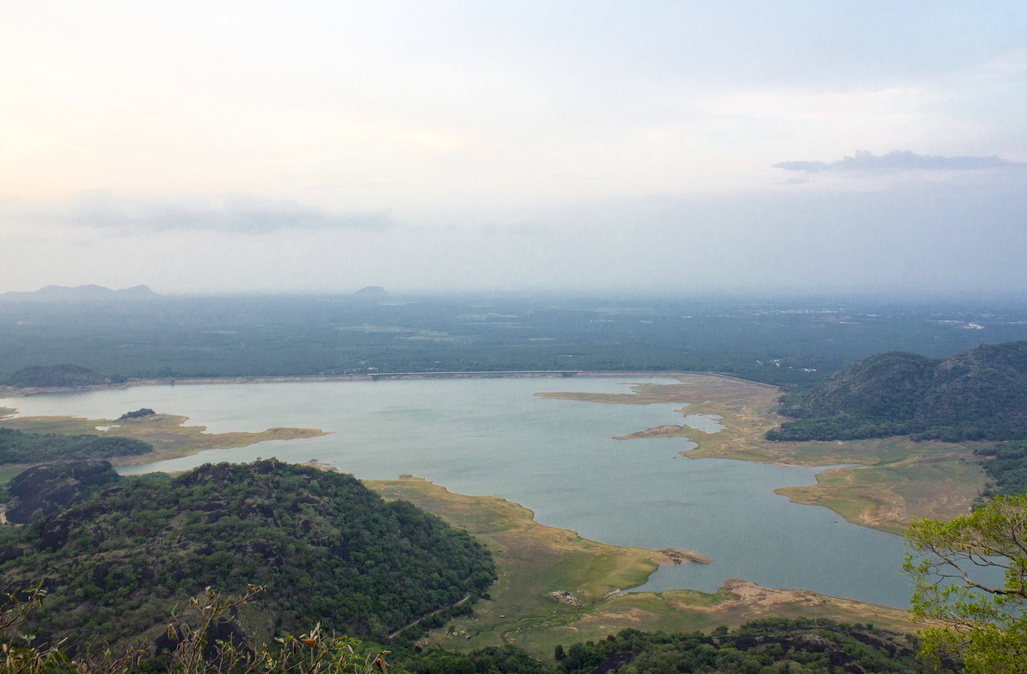 Body of water,Sky,Water resources,Water,Highland,Reservoir,Atmospheric phenomenon,River,Lake,Hill station