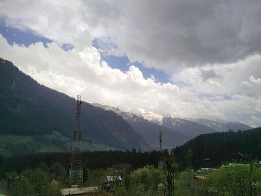 Mountainous landforms,Highland,Sky,Mountain,Cloud,Nature,Hill station,Mountain range,Hill,Valley