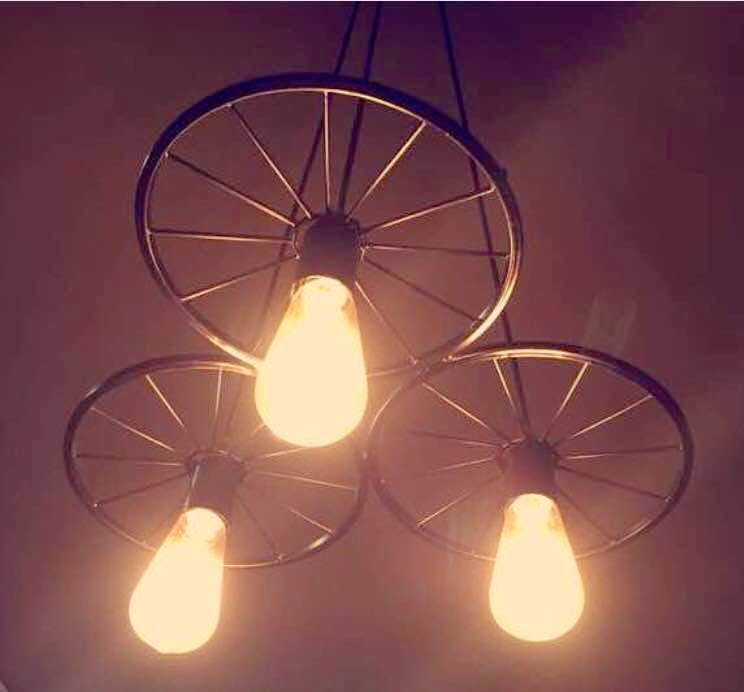 Light fixture,Lighting,Iron,Light,Sky,Lighting accessory,Ceiling,Incandescent light bulb,Metal,Chandelier