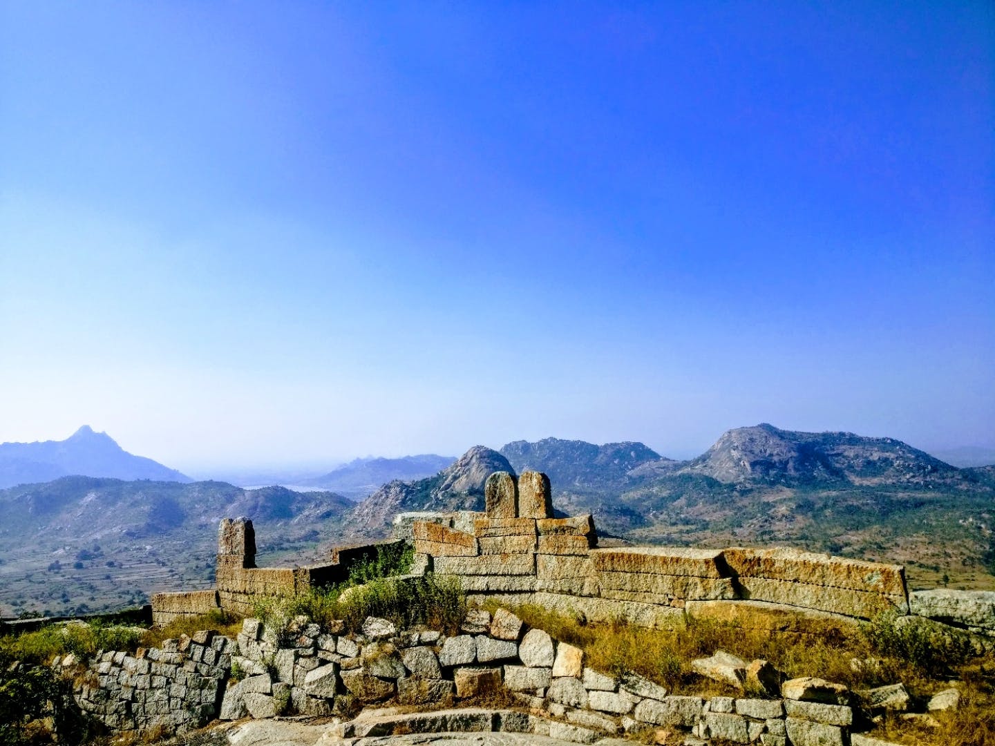 Mountainous landforms,Mountain,Sky,Landmark,Ancient history,Ruins,Historic site,Hill,Tourism,Hill station