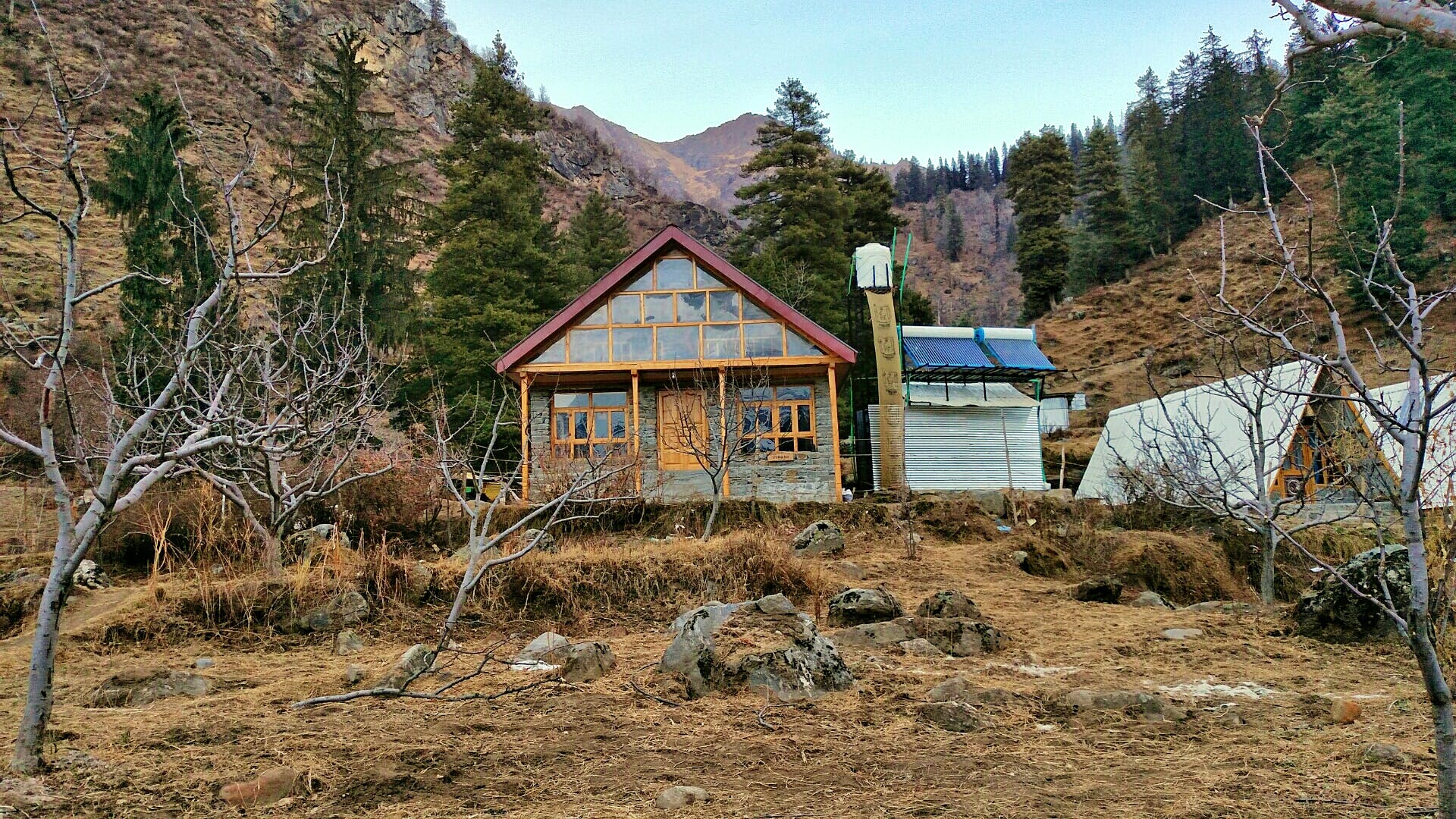 House,Property,Natural landscape,Mountain,Geological phenomenon,Tree,Wilderness,Home,Hut,Cottage