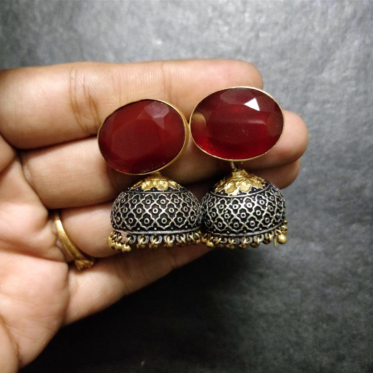 Jewellery,Red,Fashion accessory,Body jewelry,Ruby,Finger,Gemstone,Ring,Gold,Metal