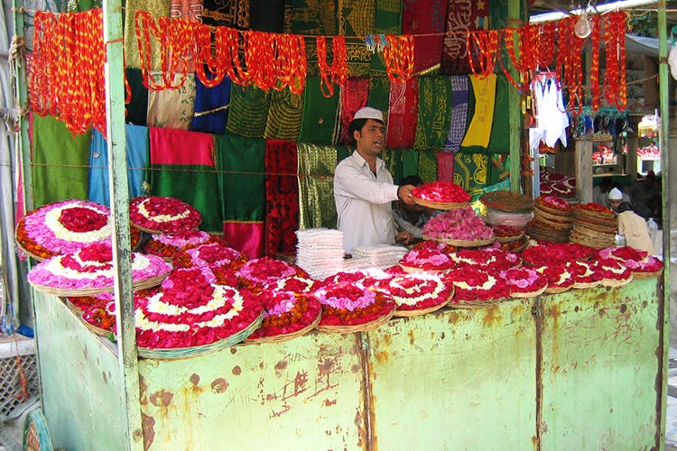 Selling,Marketplace,Market,Public space,Bazaar,Stall,Street food,Shopkeeper,Temple,Textile