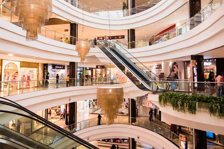 Shopping mall,Escalator,Building,Lobby,Mixed-use,Shopping,Architecture,Retail,Metropolitan area,Real estate