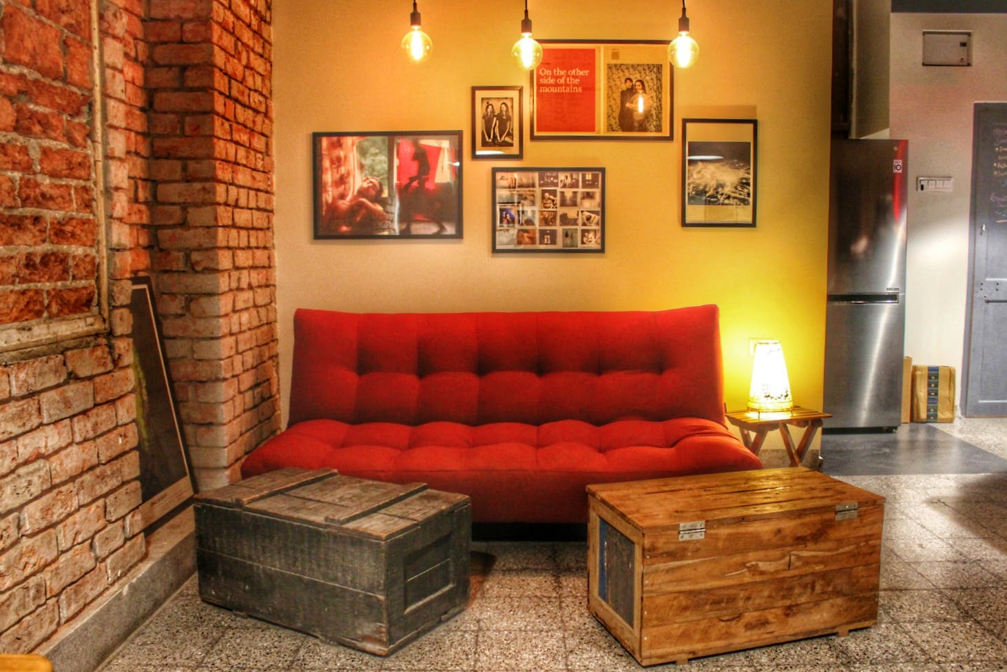 Furniture,Couch,Room,Living room,Red,Interior design,Property,Wall,Orange,Lighting