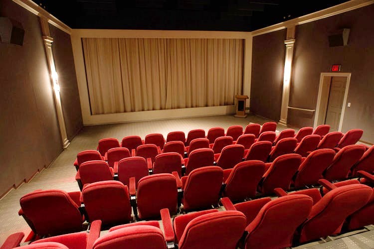 Auditorium,Theatre,heater,Building,Movie theater,Conference hall,Interior design,Projection screen,Concert hall,Stage