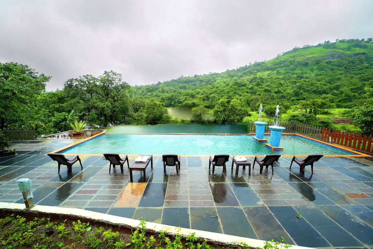 Sky,Leisure,Hill station,Tree,Swimming pool,Architecture,Mountain,Cloud,Tourism,River