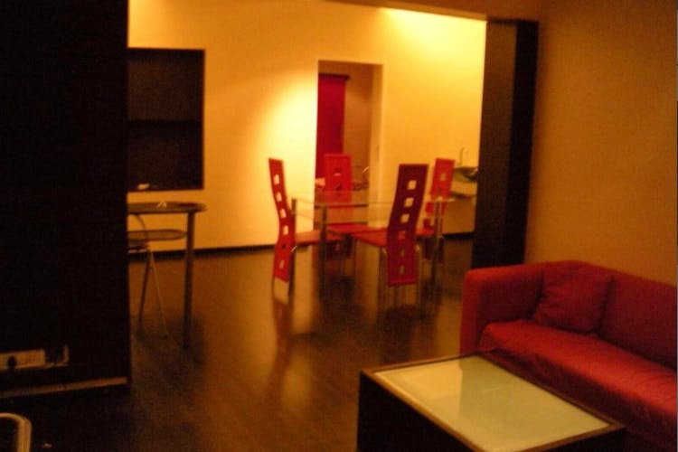 Room,Property,Interior design,Orange,Furniture,House,Living room,Building,Floor,Table