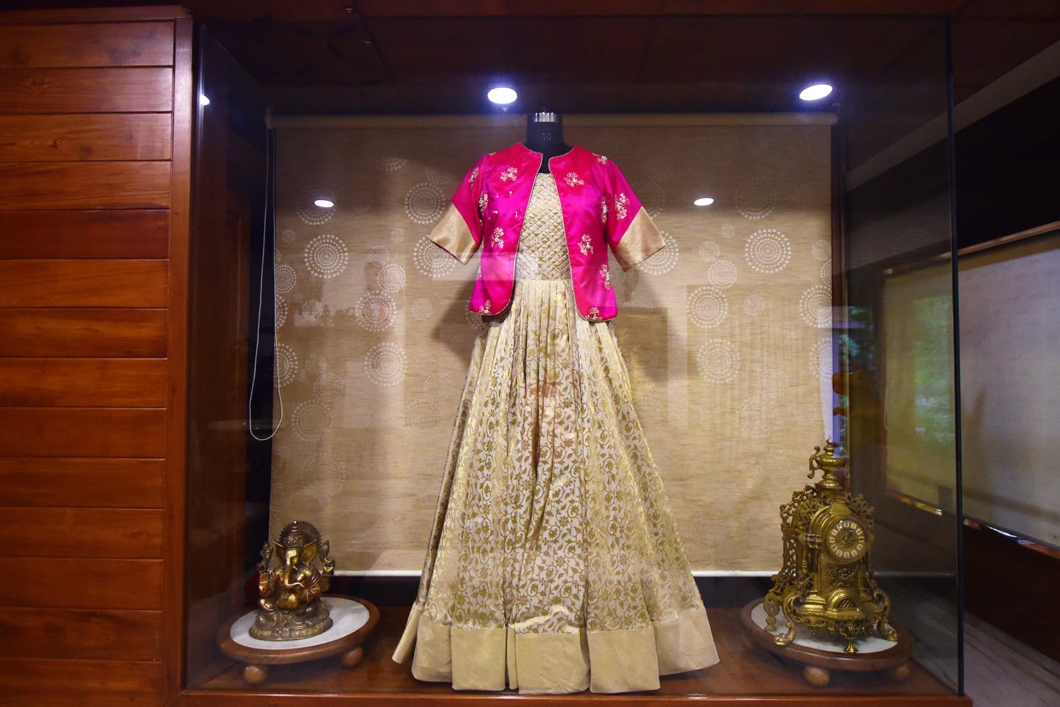 Clothing,Dress,Fashion,Formal wear,Display window,Tradition,Gown,Fashion design,Costume,Temple