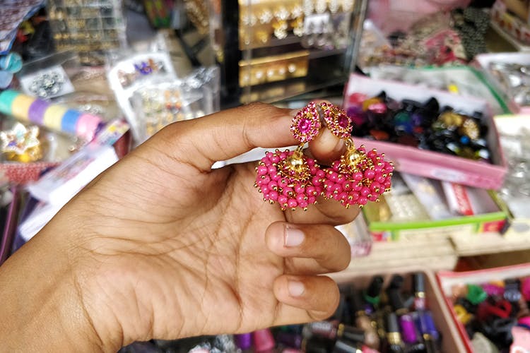 Pink,Nail,Hand,Finger,Fashion accessory,Bead,Jewellery,Magenta,Bangle