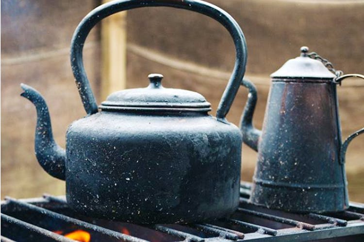 Kettle,Teapot,Small appliance,Iron,Stovetop kettle,Home appliance,Still life,Still life photography,Cookware and bakeware,Tableware