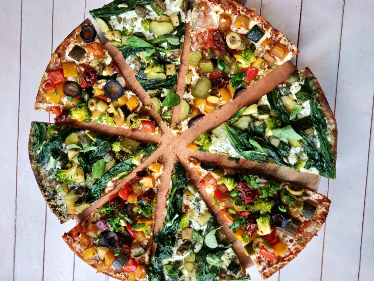 Dish,Cuisine,Pizza,Food,Flatbread,Ingredient,Leaf vegetable,California-style pizza,Pizza cheese,Produce