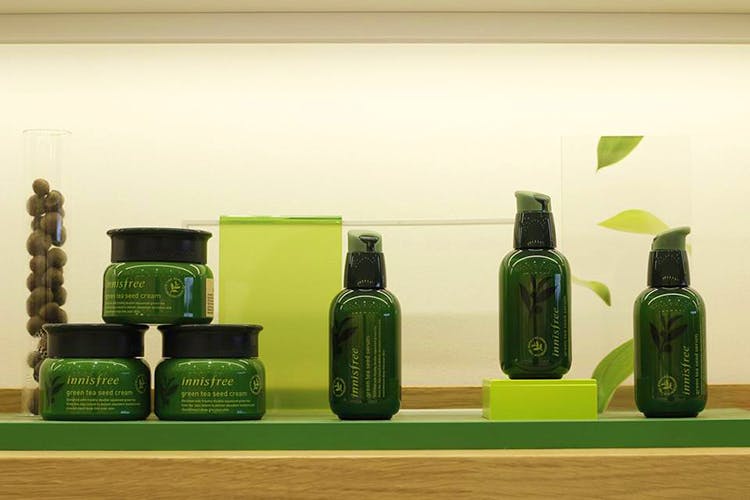 Bottle,Green,Product,Glass bottle,Glass,Shelf,Still life,Collection