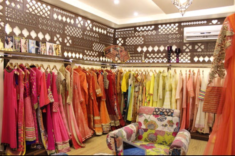 Boutique,Room,Clothing,Closet,Outlet store,Fashion,Pink,Retail,Building,Textile