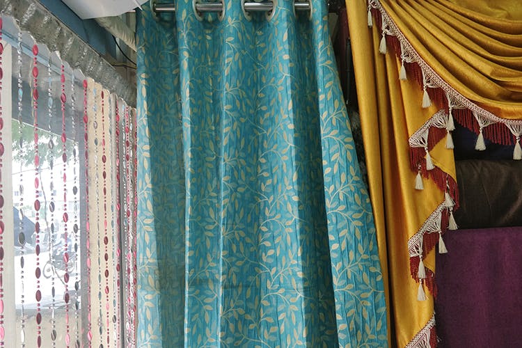 Curtain,Window treatment,Blue,Interior design,Textile,Turquoise,Room,Window covering,Window valance,Interior design