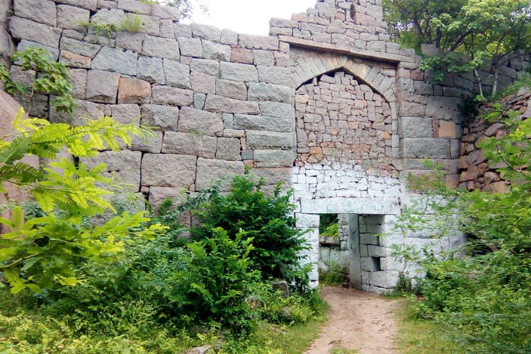 Wall,Property,House,Building,Cottage,Stone wall,Rural area,Tree,Village,Brick