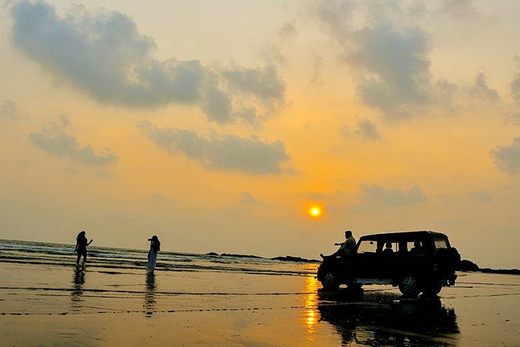 Sky,Vehicle,Sunset,Cloud,Horizon,Sea,Off-road vehicle,River,Calm,Evening