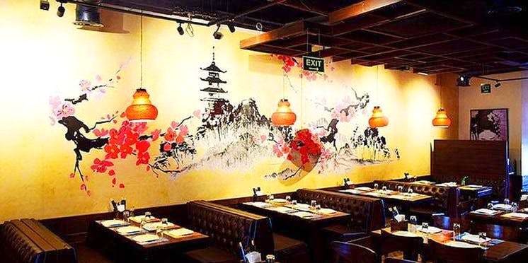 Restaurant,Interior design,Wall,Room,Table,Building,Mural,Art