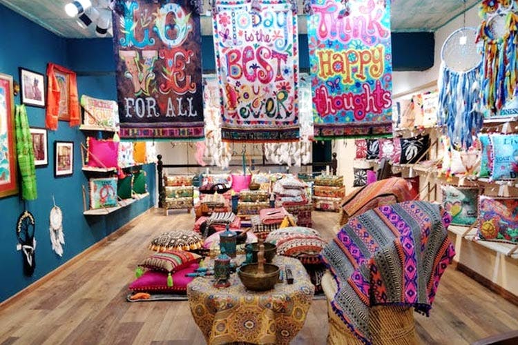 Pink,Interior design,Room,Boutique,Textile,Building,Retail,Bazaar,Outlet store,Furniture