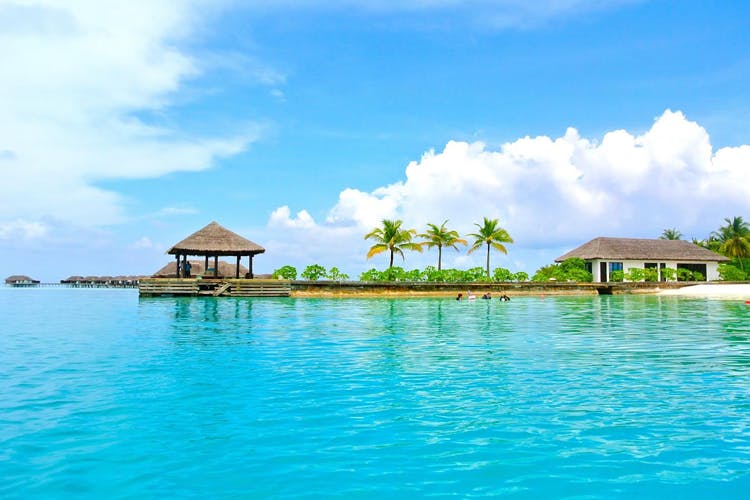 Tropics,Sky,Vacation,Natural landscape,Caribbean,Sea,Lagoon,Resort,Turquoise,Coastal and oceanic landforms
