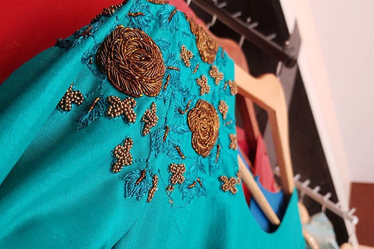 Blue,Turquoise,Clothing,Aqua,Teal,Shoulder,Textile,Embroidery,Dress,Fashion design