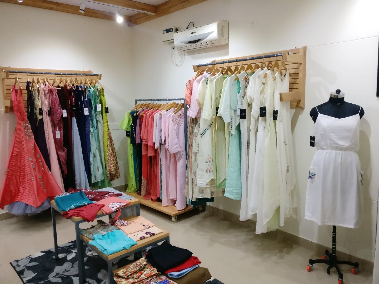 Boutique,Room,Clothing,Clothes hanger,Fashion,Dress,Furniture,Outlet store,Textile,Interior design