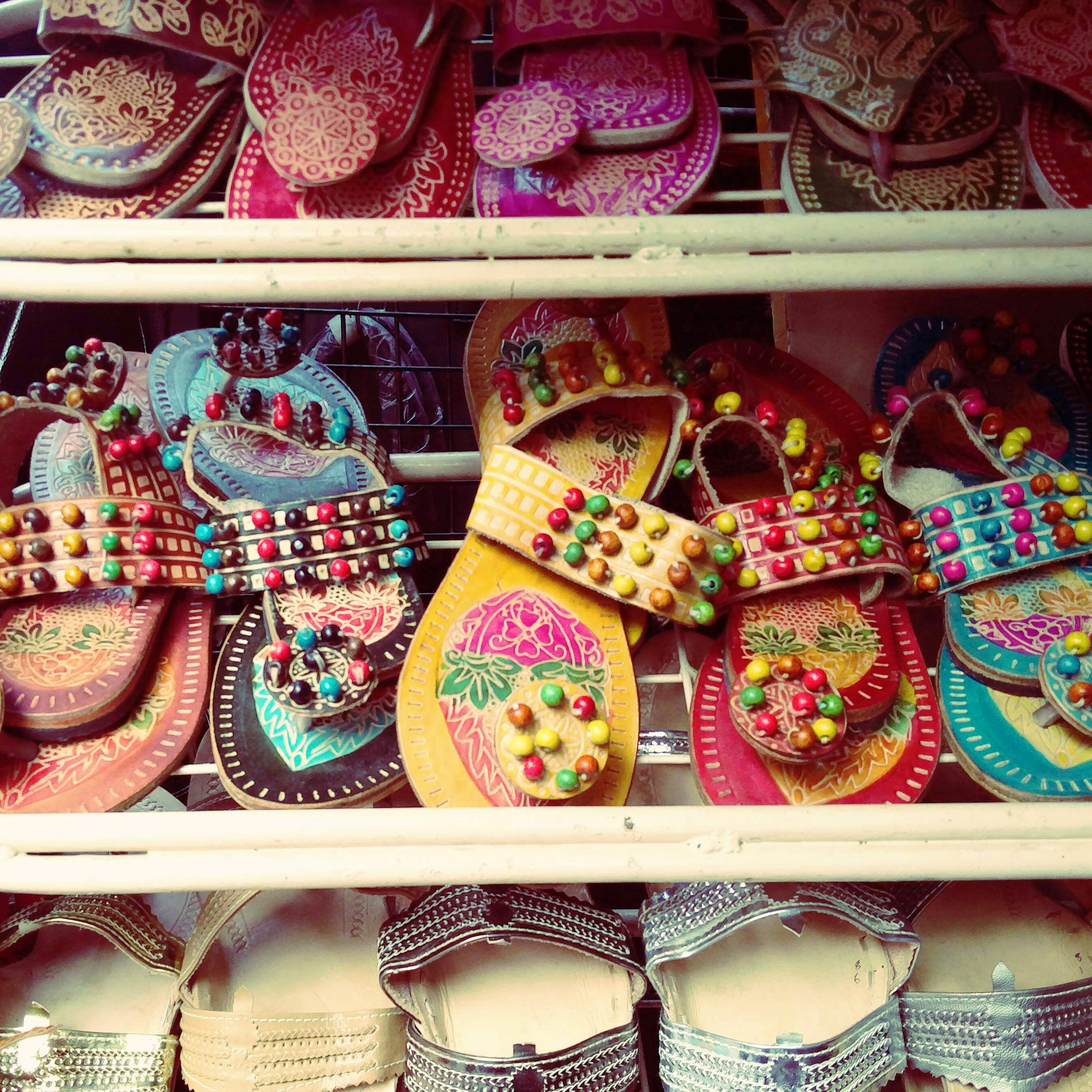 Pink,Footwear,Tradition,Shoe,Textile,Fashion accessory,Souvenir