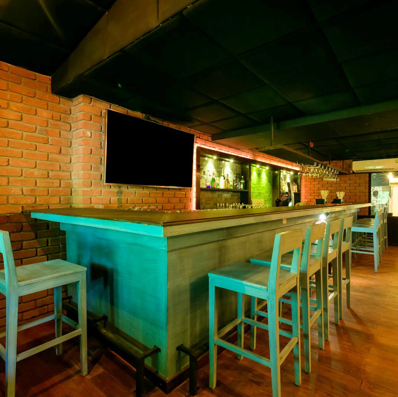 Table,Room,Furniture,Lighting,Bar stool,Building,Bar,Architecture,Interior design,Recreation room