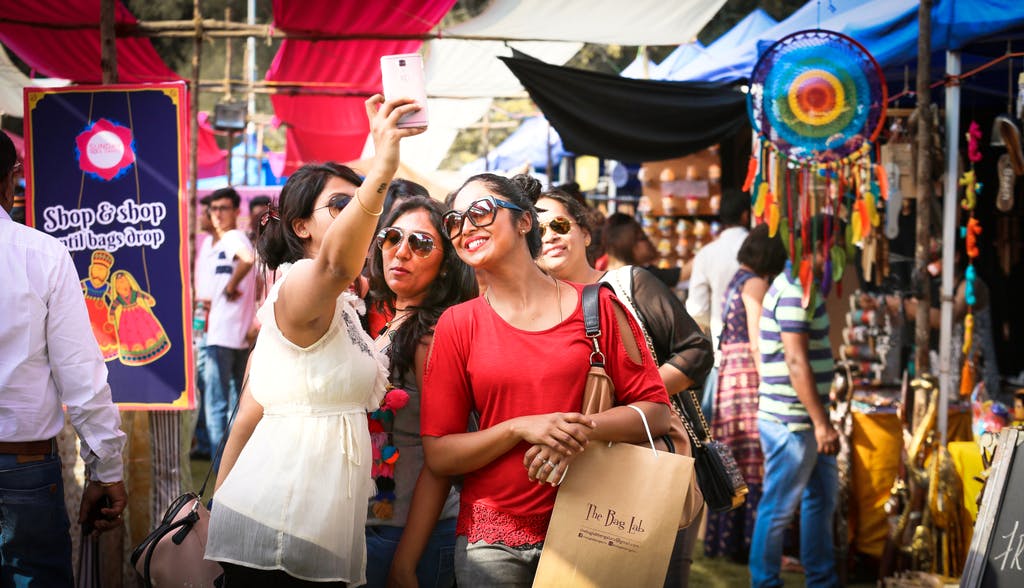 People,Public space,Event,Fun,Shopping,Crowd,Yellow,Bazaar,Marketplace,Market
