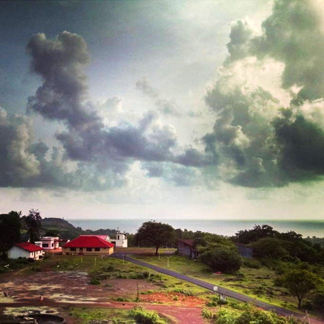 Sky,Cloud,Nature,Natural landscape,Daytime,Atmospheric phenomenon,Atmosphere,Wilderness,Cumulus,Tree