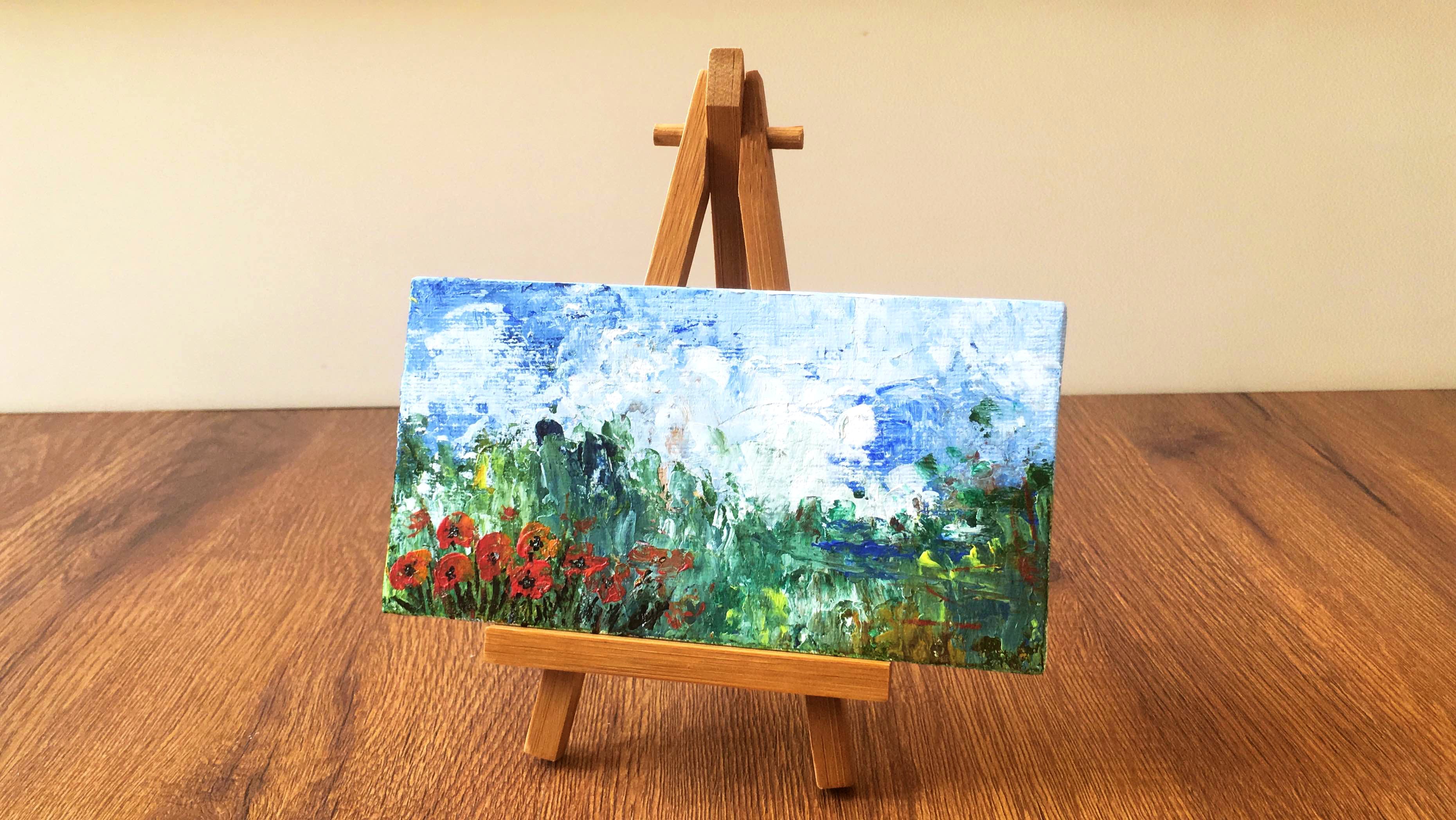 Easel,Acrylic paint,Wood,Painting,Paint,Wildflower,Table,Hardwood,Watercolor paint,Visual arts
