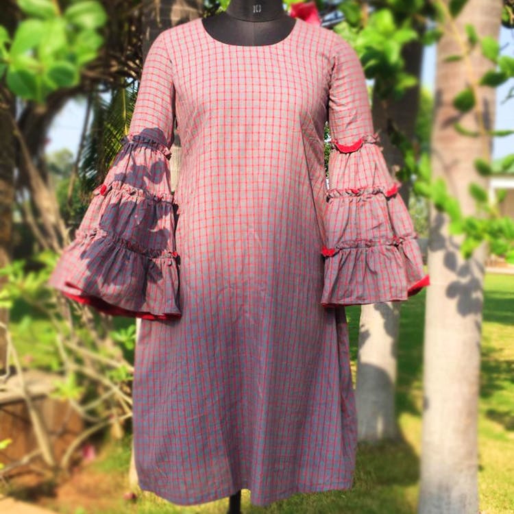 Clothing,Pink,Outerwear,Dress,Sleeve,Day dress,Textile,Pattern,Peach,Wool
