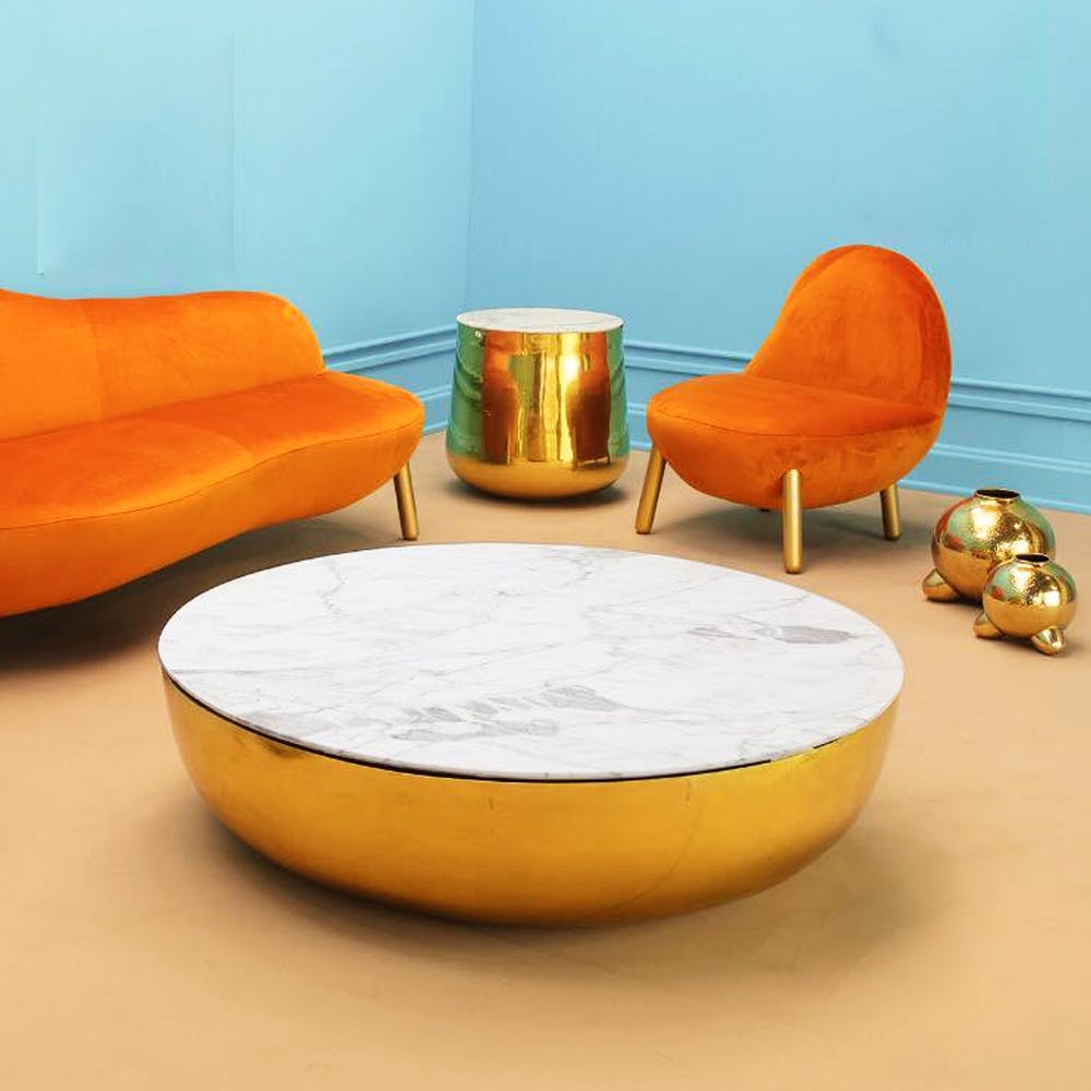 Orange,Furniture,Coffee table,Table,Yellow,Couch,Interior design,Ottoman,Room,Chair