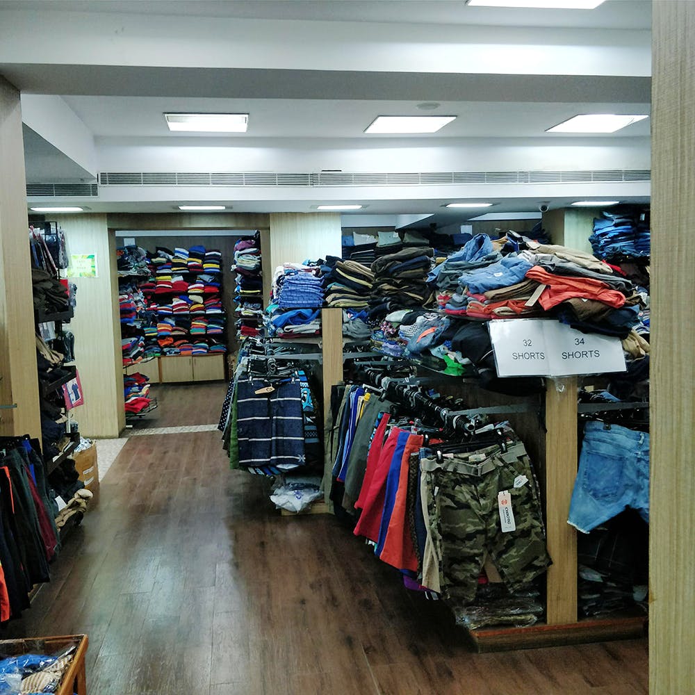 Outlet store,Building,Footwear,Retail,Room,Aisle,Collection,Shoe,Athletic shoe