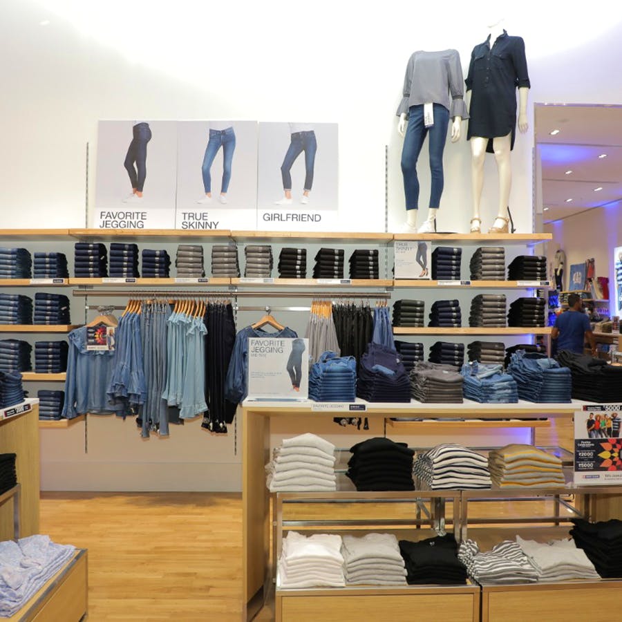 Boutique,Outlet store,Room,Building,Retail,Footwear,Textile,Interior design,Furniture,Jeans