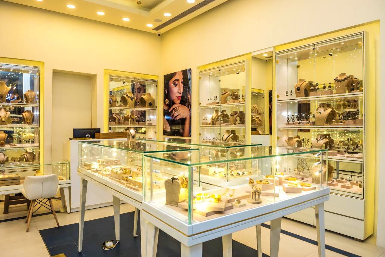 Display case,Building,Yellow,Museum,Interior design,Bakery,Tourist attraction,Collection,Room,Art gallery