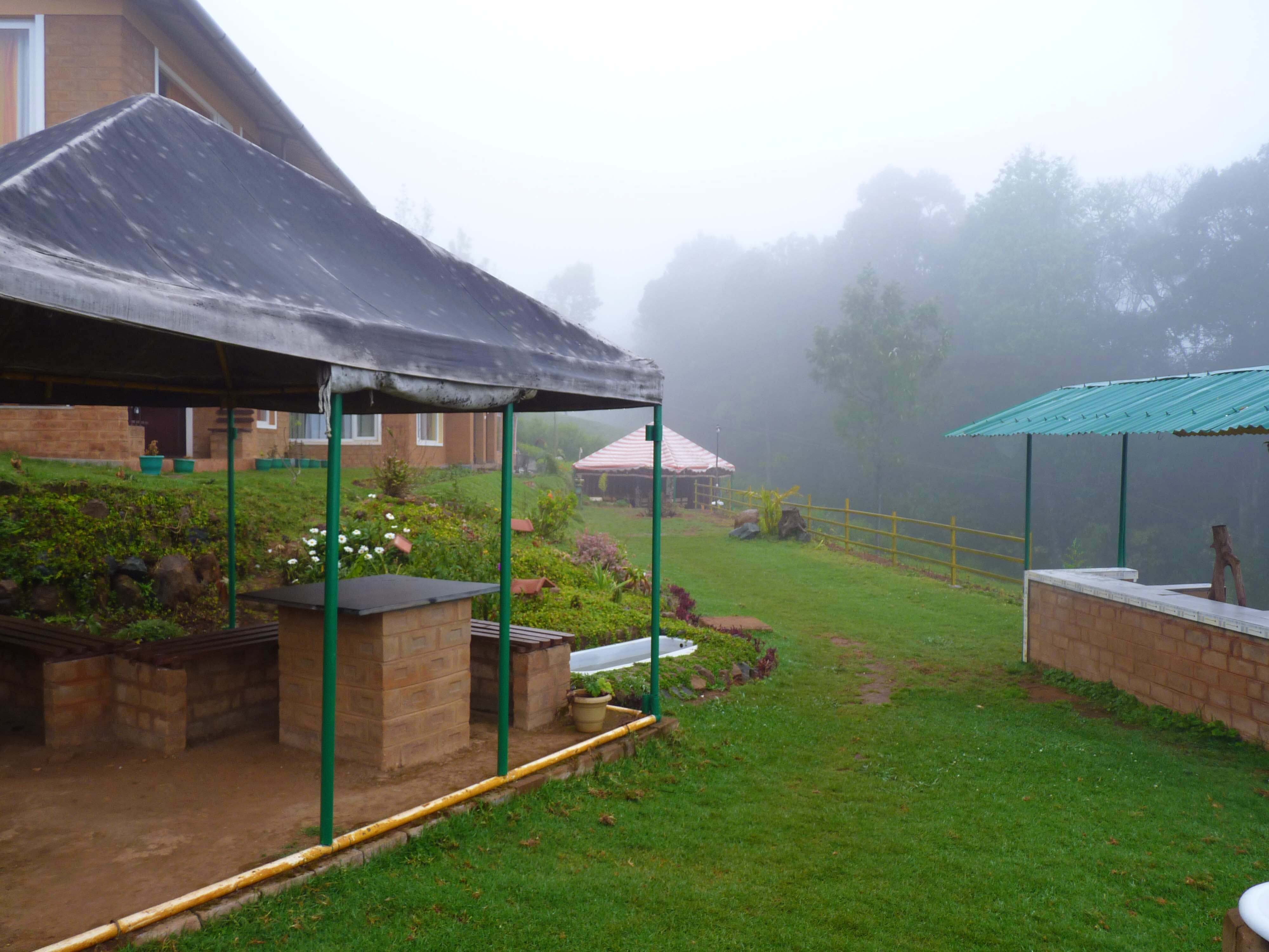 Grass,Atmospheric phenomenon,Roof,Shade,Yard,Hill station,House,Backyard,Land lot,Landscape