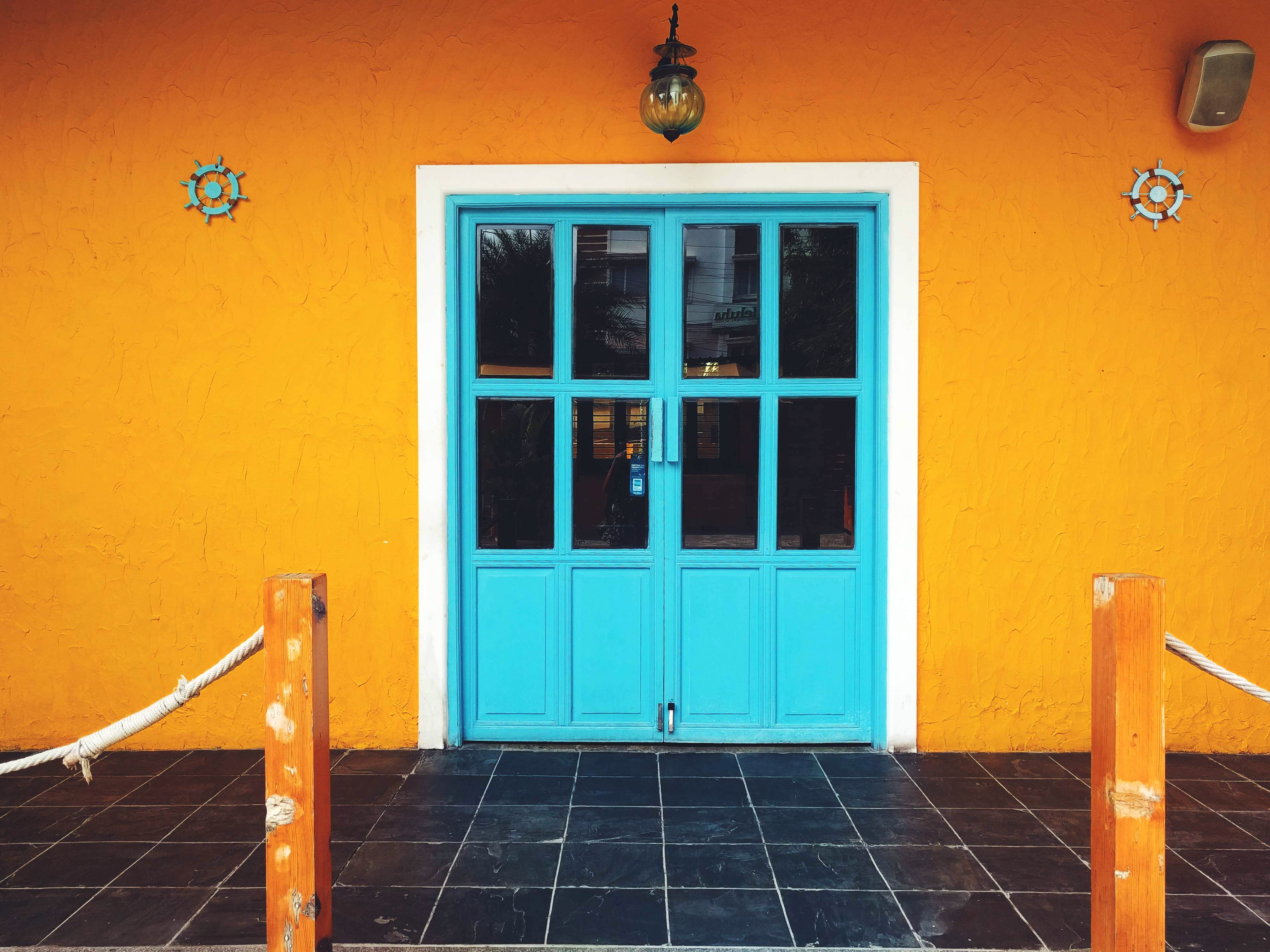 Blue,Orange,Yellow,Property,Door,Turquoise,Wall,House,Room,Floor