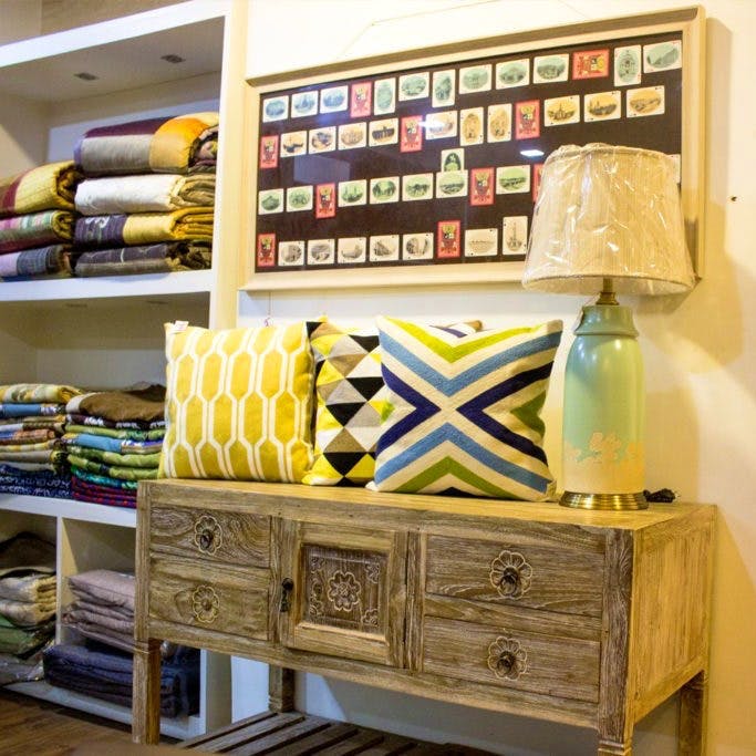 Furniture,Room,Yellow,Shelf,Interior design,Drawer,Chest of drawers,Table,Living room,Textile
