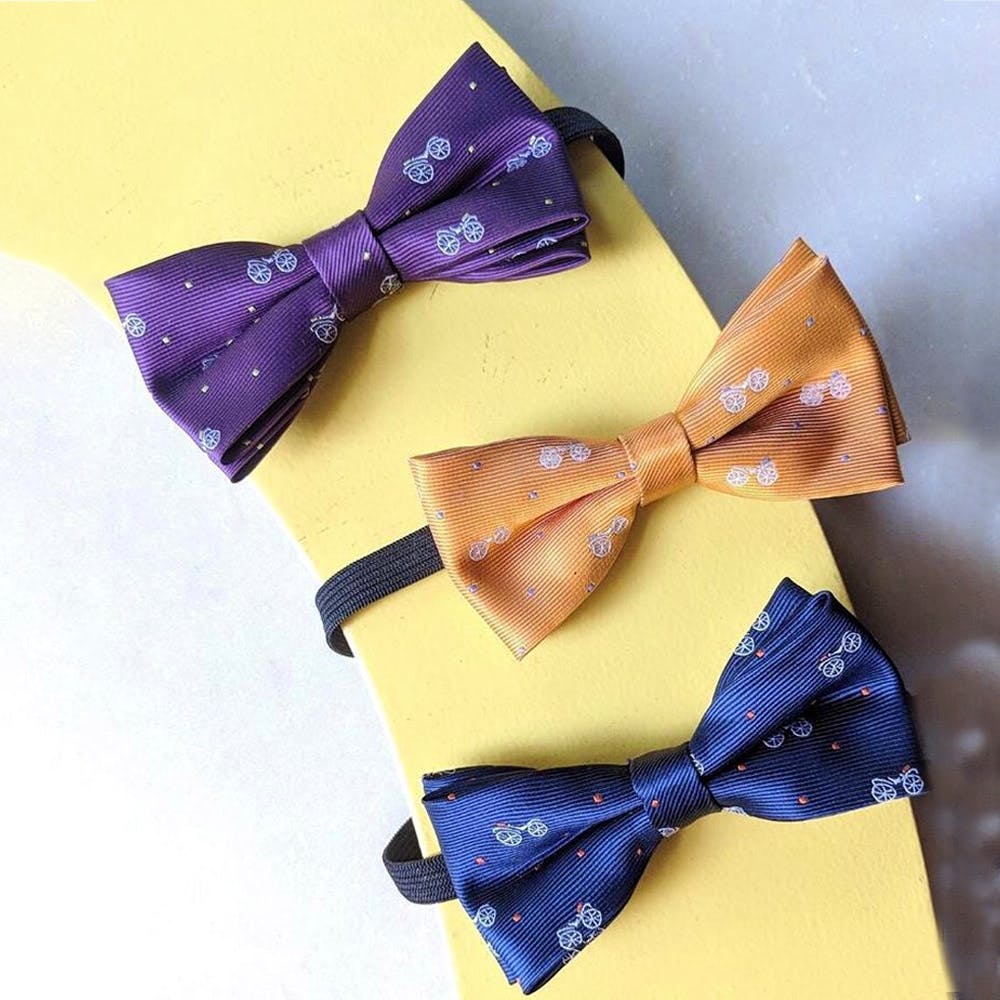 Bow tie,Tie,Yellow,Purple,Fashion accessory,Formal wear
