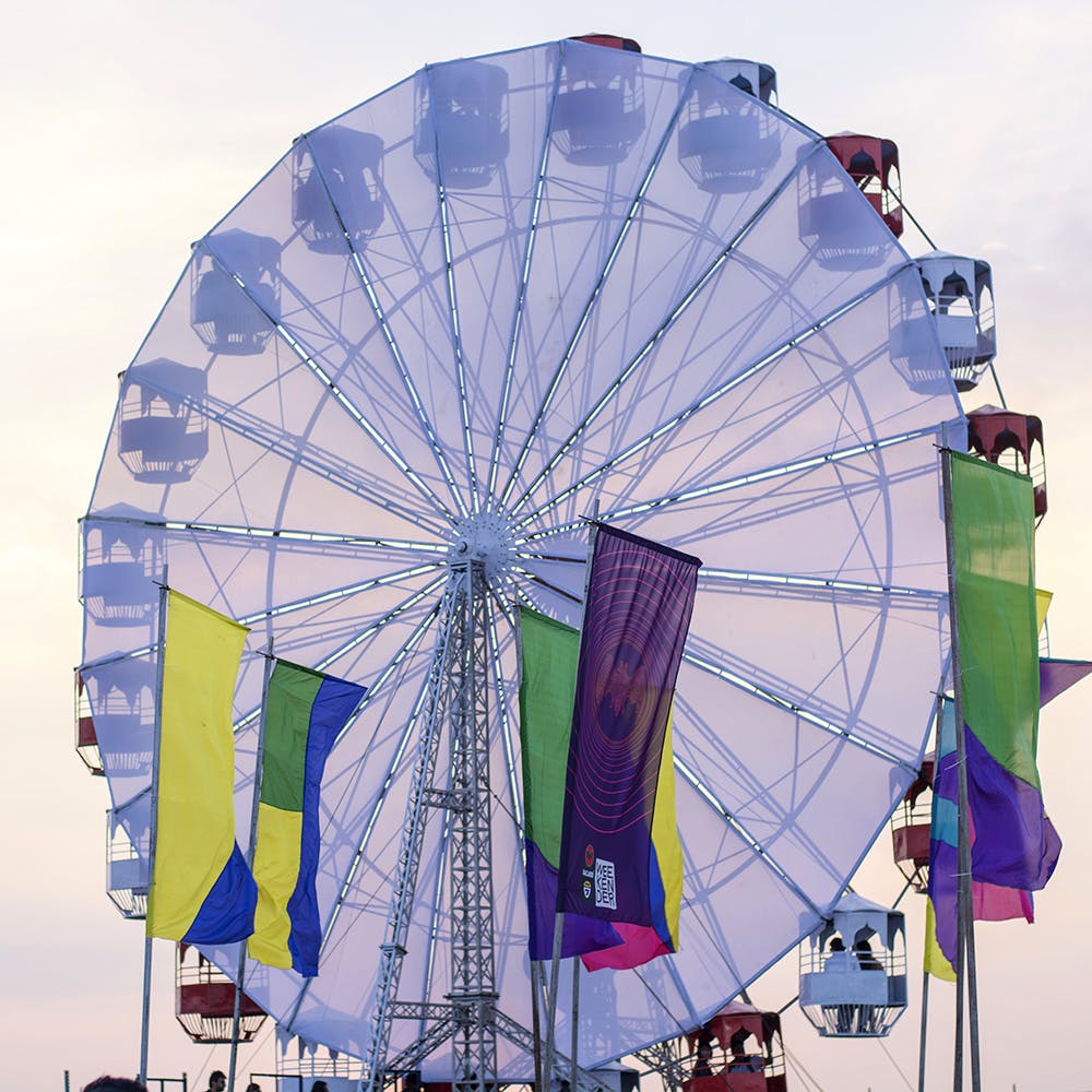 Ferris wheel,Amusement park,Tourist attraction,Recreation,Amusement ride,Sky,Fair,Fun,Wheel,Nonbuilding structure