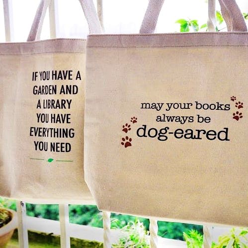 Bag,Text,Tote bag,Handbag,Font,Grass,Tree,Luggage and bags,Plant,Shopping bag