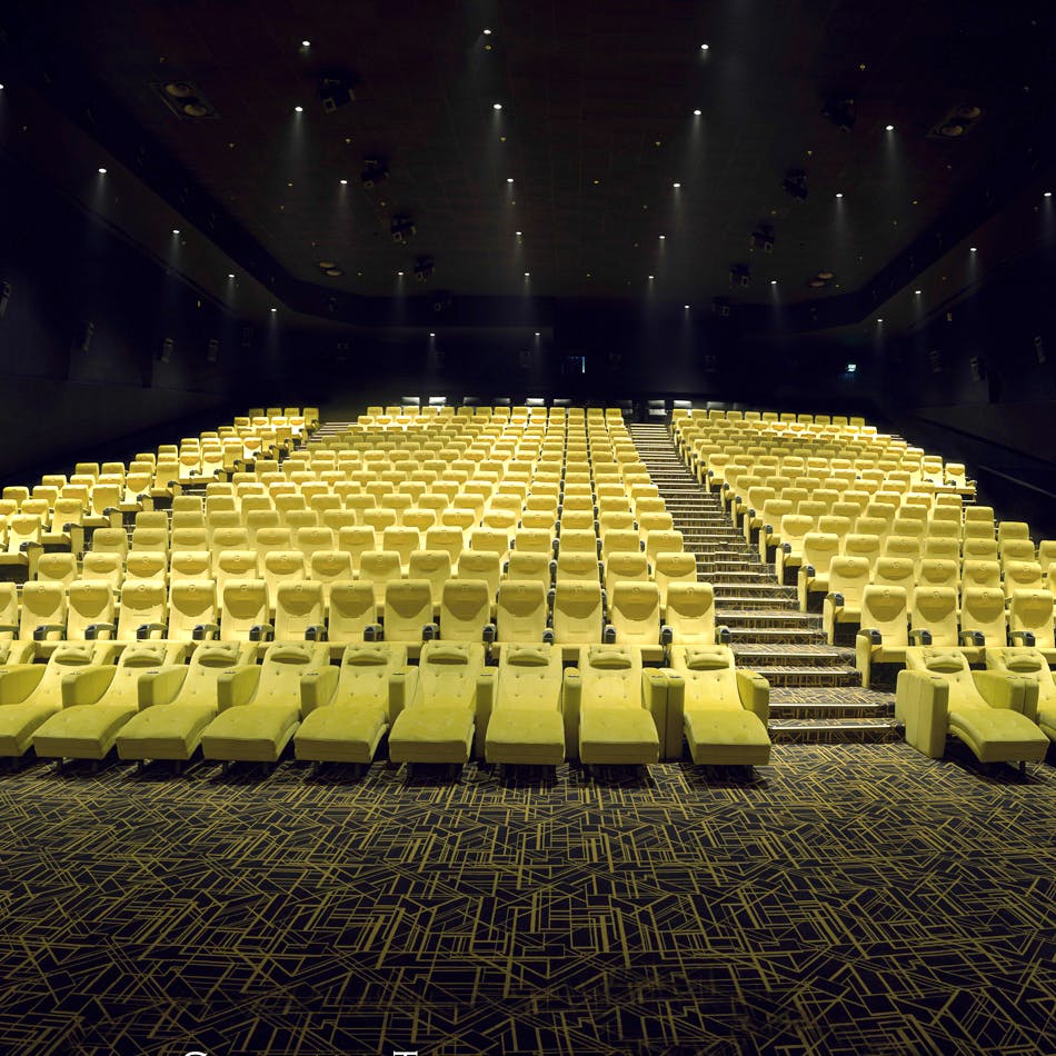 Auditorium,Concert hall,Theatre,Performing arts center,Yellow,Stage,heater,Architecture,Convention center,Chair