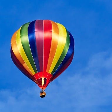 Hot air balloon,Hot air ballooning,Air sports,Sky,Balloon,Mode of transport,Blue,Air travel,Vehicle,Light