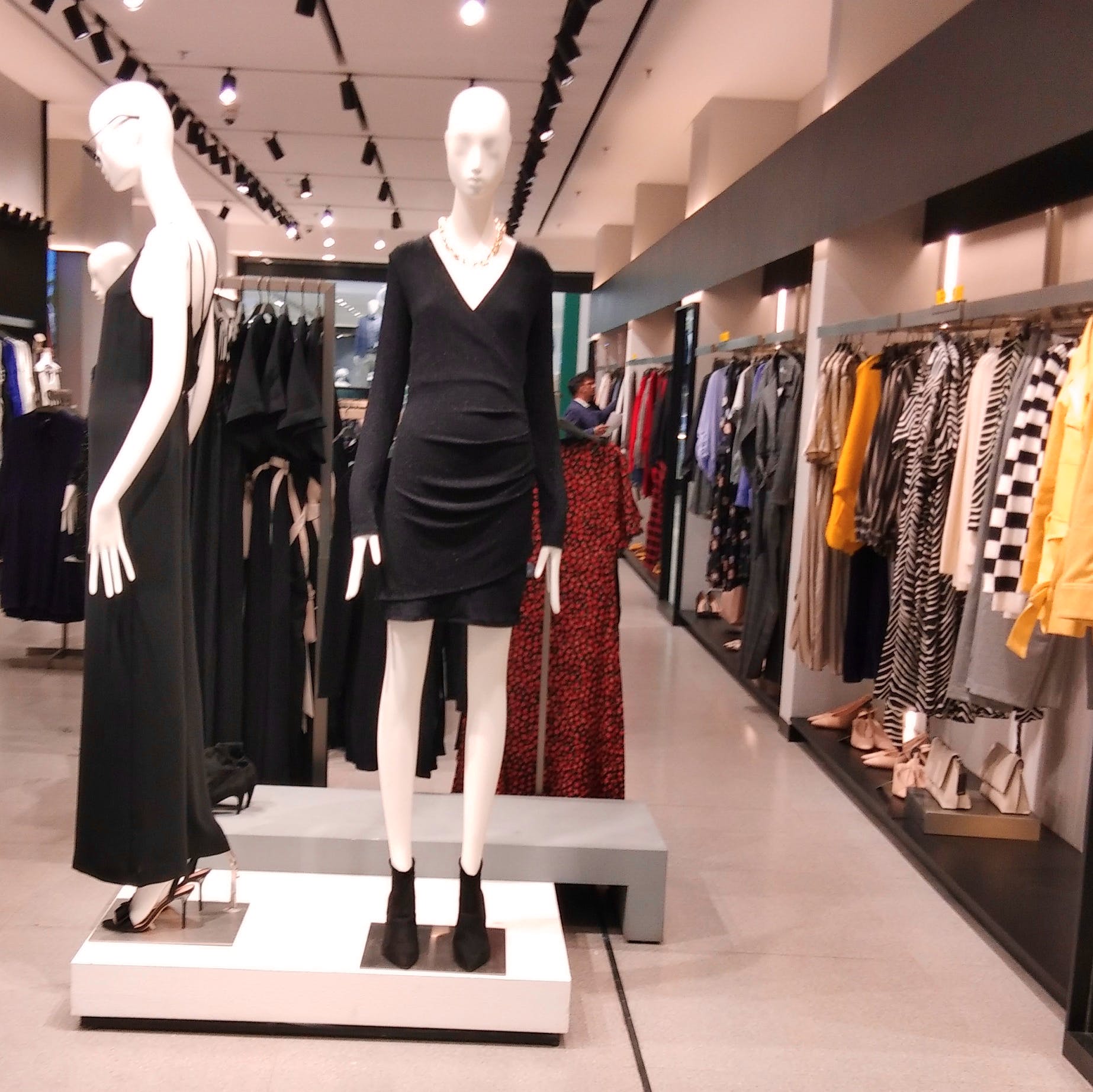 Boutique,Clothing,Fashion,Retail,Outlet store,Mannequin,Fashion design,Dress,Design,Black-and-white