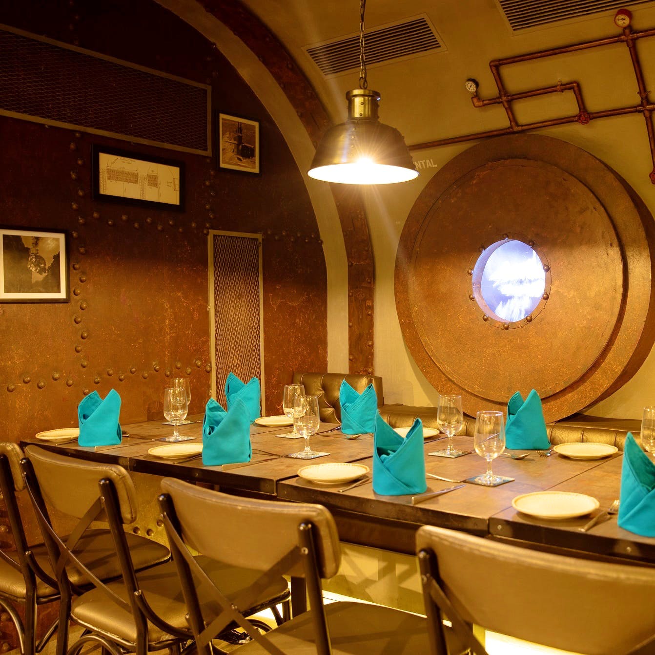 Turquoise,Restaurant,Table,Room,Interior design,Function hall,Building,Dining room